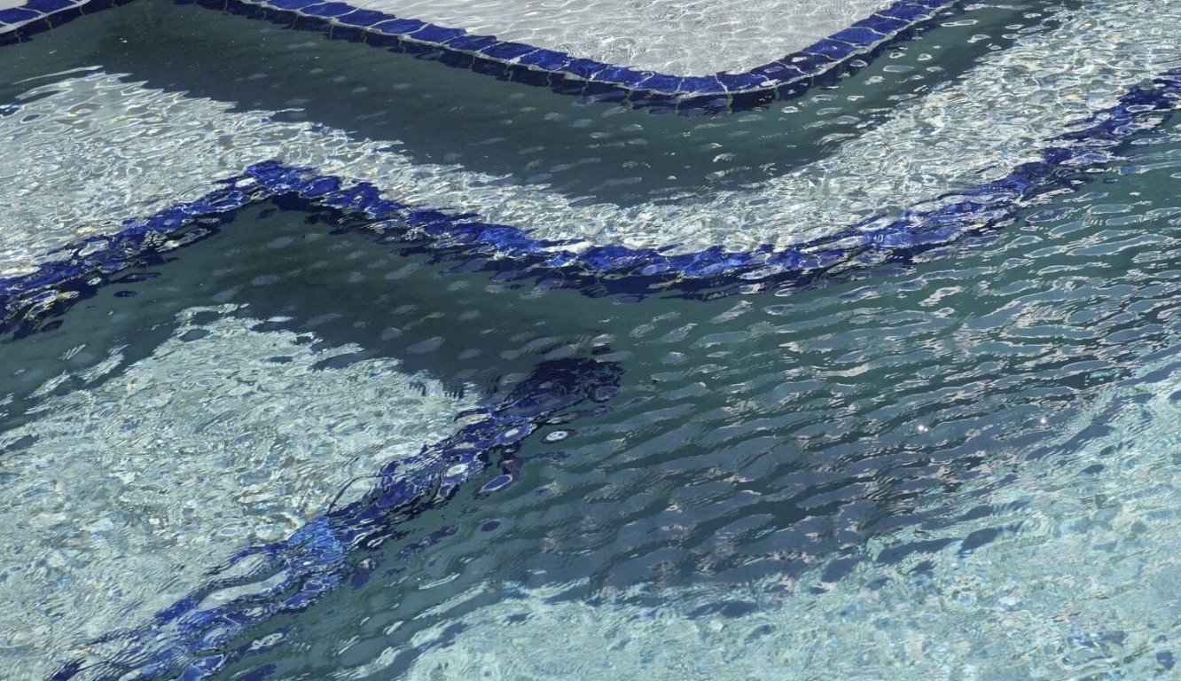 Professional calcium scale removal on pool tiles in Cypress, CA